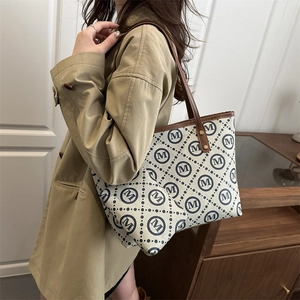 Classic monogram canvas tote bag with matching pouch set and brown leather handles