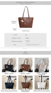 Detail view of large crocodile pattern tote bag in black brown and beige PU leather