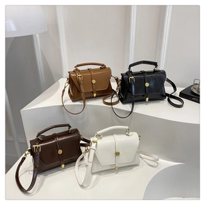 Detailed view of vintage minimalist crossbody bags in brown, black, and cream leather