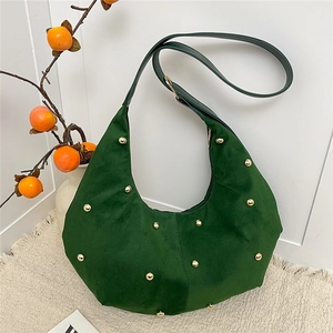 Dark green suede hobo bag with gold studs and adjustable shoulder strap for women