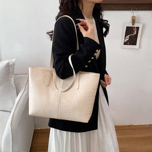 Chic beige crocodile pattern large capacity tote bag shown in a professional lifestyle setting
