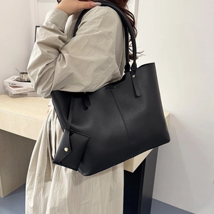 Large black minimalist leather tote bag with small pouch for daily urban commute
