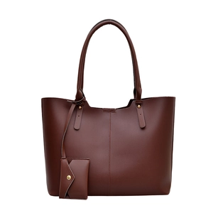 Minimalist large capacity dark brown leather tote bag with a small matching purse