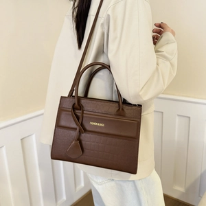 Brown faux crocodile leather handbag with top handles and shoulder strap for women