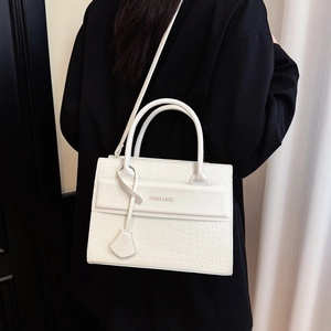 White faux crocodile leather tote bag with top handles and fashion lettering print