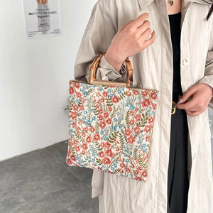 Floral embroidered tote bag with natural bamboo handles for daily commuting and shopping