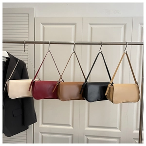 Detailed display of minimalist baguette bags in cream, burgundy, coffee, black, and khaki