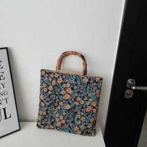Vintage floral embroidery tote bag with natural bamboo handles and spacious design