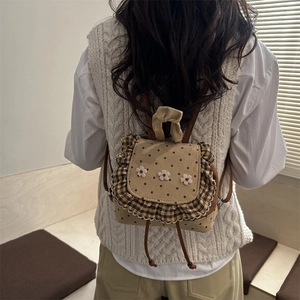 Minimalist polka dot backpack with knit flower accents for women in khaki and brown