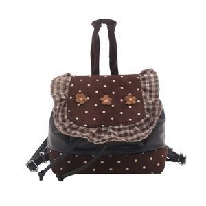 Cute brown polka dot drawstring backpack with floral accents and ruffle trim design