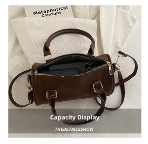 Top view of the interior space of the brown retro cylinder bag showing its large capacity