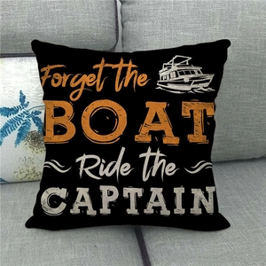 Detail of black linen pillow cover featuring Forget the BOAT Ride the CAPTAIN slogan