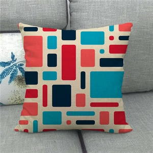 Linen square throw pillow cover featuring modern geometric pattern on a grey sofa