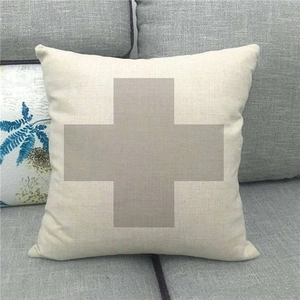 Detailed texture of linen cushion cover with grey cross pattern on beige fabric