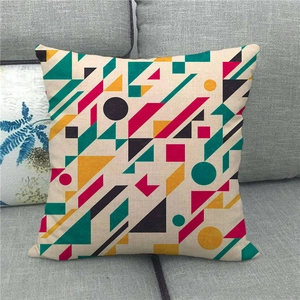 Close-up of geometric linen pillowcase showing durable texture on a grey sofa