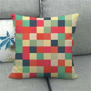 Detail of the colorful checkerboard pixel pattern on a textured linen pillow cover surface