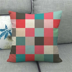 Detailed view of checkered linen pillowcase showing textured fabric on a gray sofa