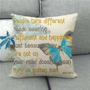 Close-up of butterfly linen pillowcase on a sofa featuring an invisible zipper closure