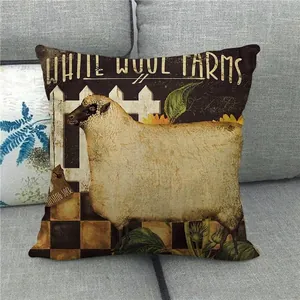 Detailed close-up of a rustic linen pillow cover with a sheep and sunflower farm print