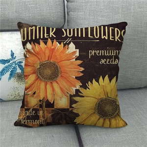 Detail of vintage linen pillowcase with yellow sunflower print and Summer text