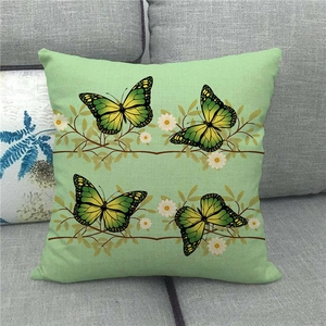 Close-up of linen pillowcase texture featuring colorful butterflies and floral patterns