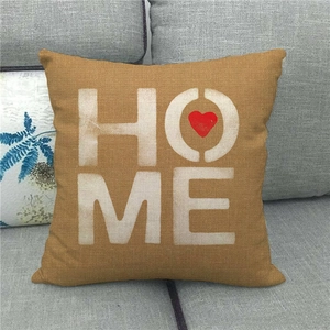 Linen HOME throw pillow cover with a red heart design on a grey sofa background