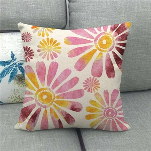 Close-up of geometric linen pillowcase with colorful watercolor chrysanthemum floral print
