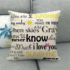 Detail of square linen pillowcase with You Are My Sunshine lyrics and sun heart pattern