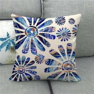 Detailed texture of linen cushion cover featuring blue abstract daisy watercolor design