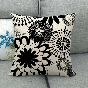 Close-up of geometric floral linen pillowcase showing thick texture on grey sofa