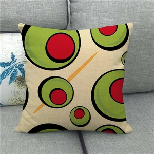 Linen blend throw pillow case with modern green olive print on gray fabric sofa