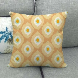 Detailed texture of geometric diamond linen cushion cover with ethnic pattern on sofa