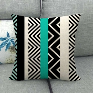 Detail of geometric pattern linen pillowcase on grey sofa for home decoration