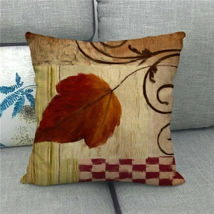 Housse de coussin en lin avec motif de feuille d'érable d'automne sur canapé