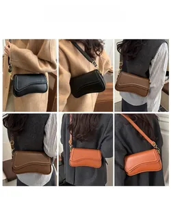 Model display of rectangular crossbody bags with wavy flap and gold buckle detail
