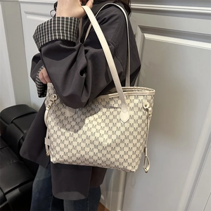 Chic beige tote bag with M-letter monogram print and double straps for daily commute