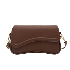 Minimalist dark brown crossbody bag with wavy flap design and gold metallic buckle