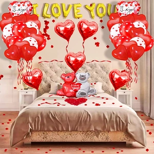 Close-up of Valentine bear balloons with red hearts and I LOVE YOU gold foil letters