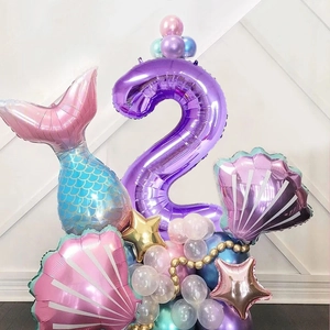 Detail of mermaid theme number 2 balloon stand with shell and tail foil balloons