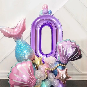 Detail of mermaid theme balloon set with purple number zero and seashell foils