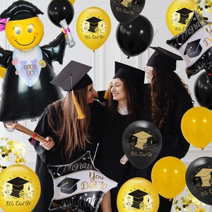 Graduation party decor with Congrats foil balloons and graduates in the background