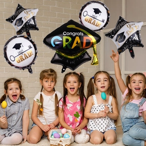 Graduation balloon set with star and cap shapes for party decor in black and gold