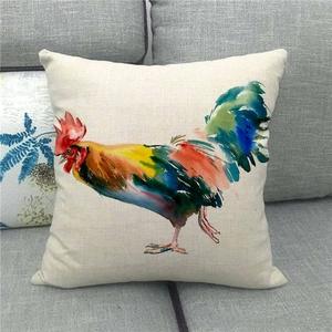 Rustic rooster watercolor linen pillow cover on sofa featuring colorful artistic farmhouse style