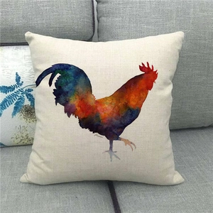 Detailed close-up of a watercolor rooster print on a rustic linen pillowcase on a sofa