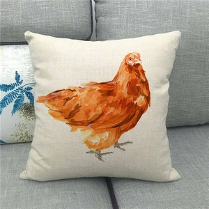 Close-up of linen throw pillow cover featuring a detailed watercolor chicken print on a sofa