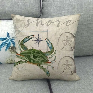Linen anchor crab pillow cover with compass design on gray sofa decor