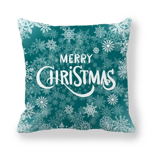 Christmas dark teal square pillow cover with white Merry Christmas text and snowflake patterns