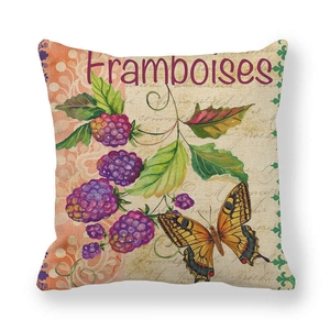 Macro detail of linen pillowcase featuring vintage raspberry and butterfly botanical prints