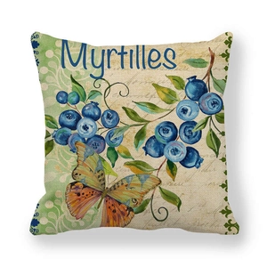 Close-up of linen cushion cover featuring vintage blueberry and butterfly patterns