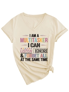 Detail of V-neck beige t-shirt featuring multicolor slogan print and side knot detail
